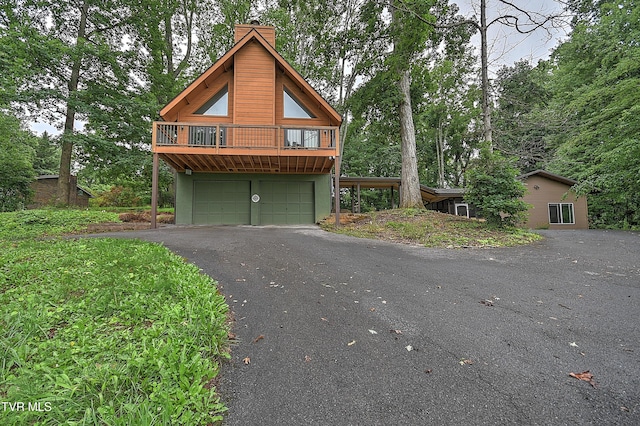 190 Sycamore Cir, Jonesborough, TN 37659 - view of front of house featuring a chimney, asphalt driveway, and a garage