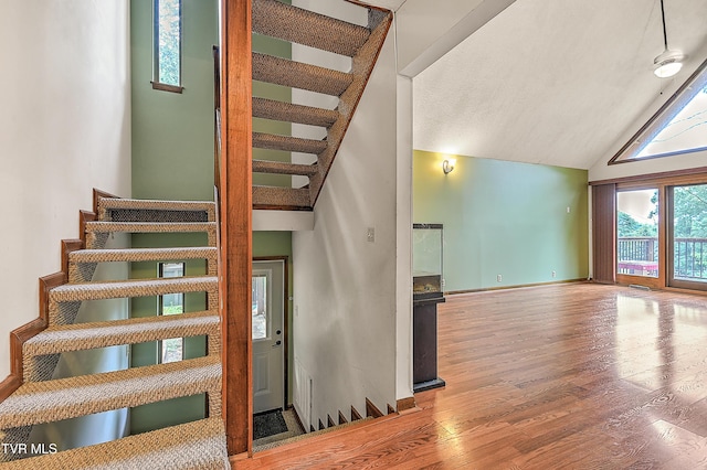 190 Sycamore Cir, Jonesborough, TN 37659 - staircase with wood finished floors and high vaulted ceiling
