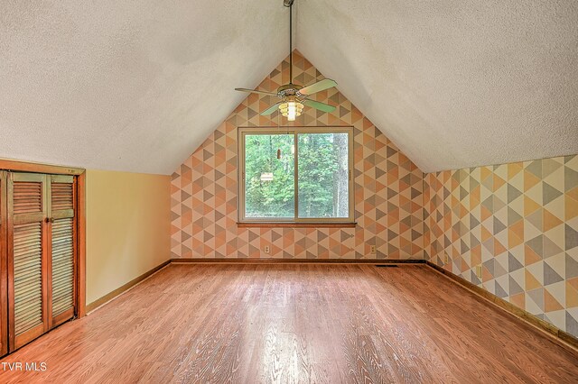 190 Sycamore Cir, Jonesborough, TN 37659 - additional living space with a textured ceiling, light wood-style floors, lofted ceiling, ceiling fan, and wallpapered walls