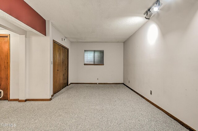 190 Sycamore Cir, Jonesborough, TN 37659 - unfurnished bedroom with carpet floors, a textured ceiling, a closet, and rail lighting