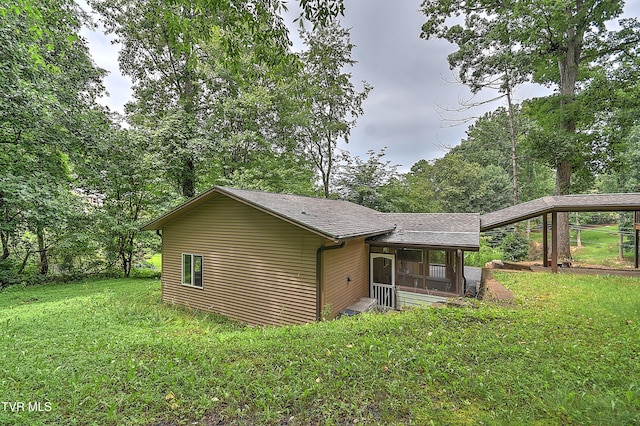 190 Sycamore Cir, Jonesborough, TN 37659 - view of home's exterior featuring a sunroom, a lawn, and a shingled roof