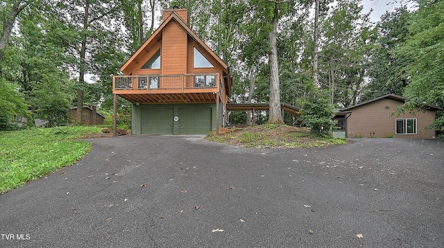 190 Sycamore Cir, Jonesborough, TN 37659 - view of front of property with driveway, a chimney, a garage, and view of wooded area