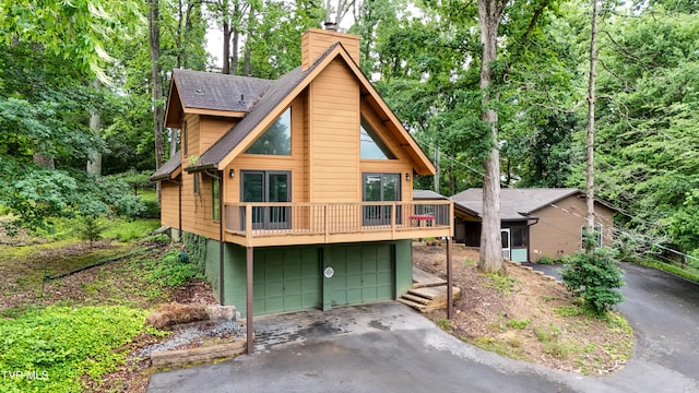 190 Sycamore Cir, Jonesborough, TN 37659 - view of front facade featuring driveway, a chimney, a shingled roof, and a garage