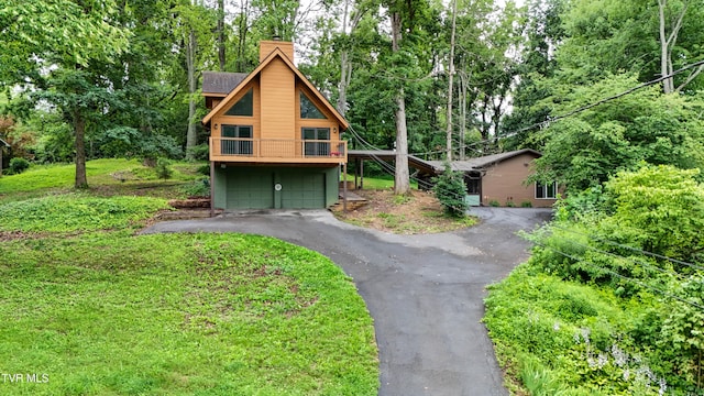 190 Sycamore Cir, Jonesborough, TN 37659 - chalet / cabin featuring driveway, a chimney, and an attached garage