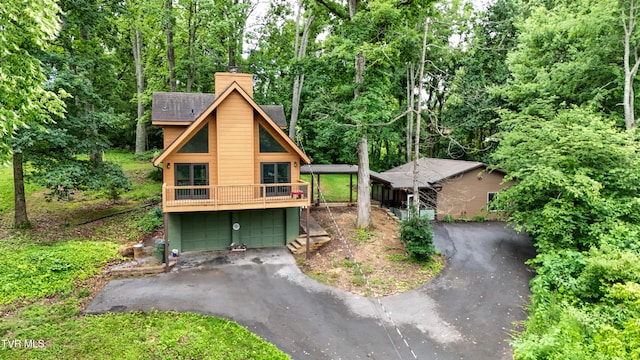 190 Sycamore Cir, Jonesborough, TN 37659 - view of front facade with a chimney, driveway, and a wooded view