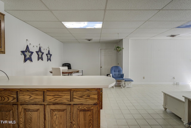 1710 Sundale Rd, Johnson City, TN 37604 - kitchen featuring a paneled ceiling, light countertops, brown cabinets, and a peninsula