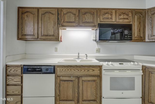 1710 Sundale Rd, Johnson City, TN 37604 - kitchen featuring white appliances, light countertops, and brown cabinetry