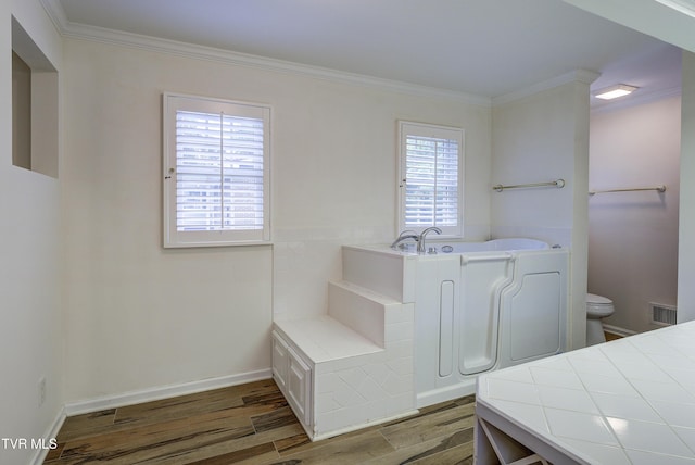 1710 Sundale Rd, Johnson City, TN 37604 - bathroom with wood finished floors, a garden tub, and ornamental molding