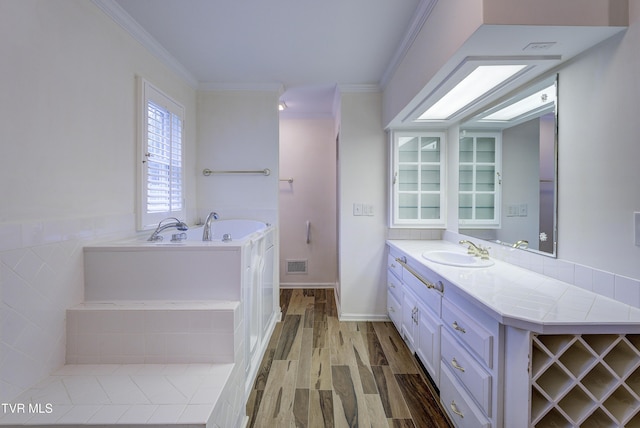 1710 Sundale Rd, Johnson City, TN 37604 - bathroom with vanity, a garden tub, ornamental molding, and wood finished floors