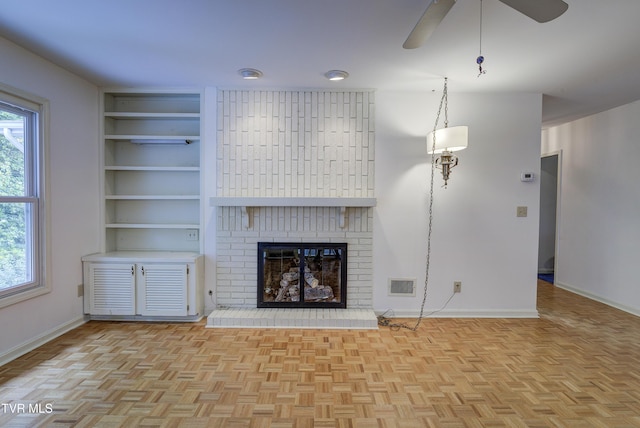 1710 Sundale Rd, Johnson City, TN 37604 - unfurnished living room with a ceiling fan, a fireplace, and built in features