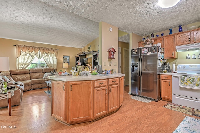 929 Cornerstone Ct, Kingsport, TN 37660 - kitchen featuring white range with electric cooktop, stainless steel fridge with ice dispenser, under cabinet range hood, open floor plan, and light wood-style floors