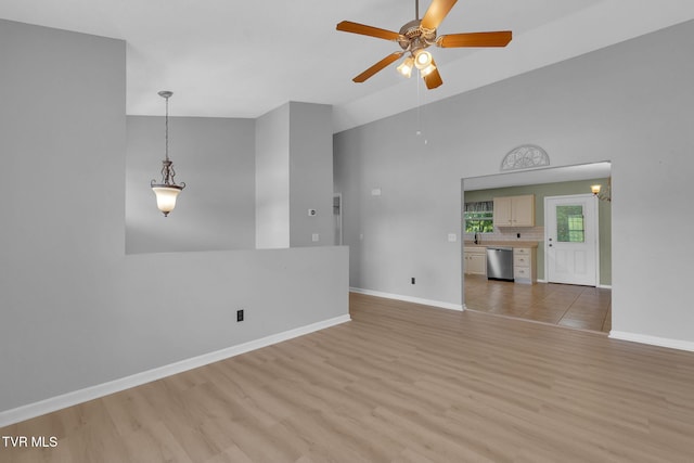 46 Taylor Ridge Ct, Johnson City, TN 37601 - unfurnished living room featuring a ceiling fan, light wood-style floors, and a high ceiling