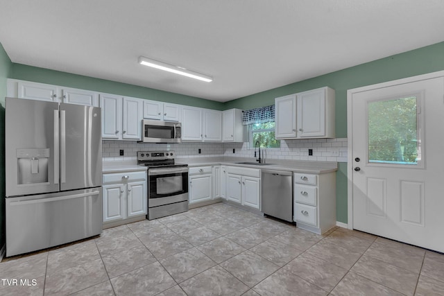 46 Taylor Ridge Ct, Johnson City, TN 37601 - kitchen with appliances with stainless steel finishes, light countertops, and decorative backsplash