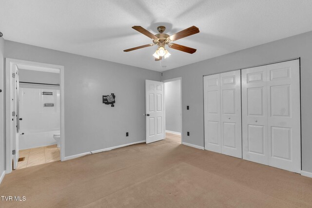 46 Taylor Ridge Ct, Johnson City, TN 37601 - unfurnished bedroom featuring carpet, ensuite bath, a closet, and ceiling fan