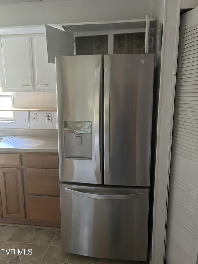 2703 Orr St, Big Stone Gap, VA 24219 - kitchen featuring stainless steel fridge, light countertops, and light tile patterned flooring