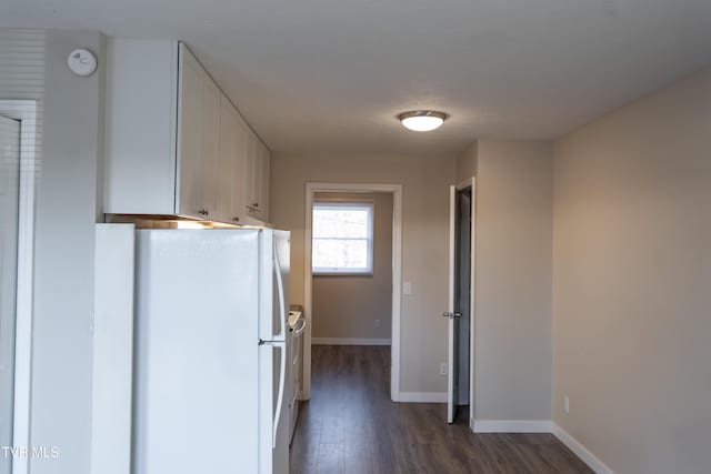 105 Lemay Dr, Kingsport, TN 37664 - kitchen with freestanding refrigerator, white cabinets, and dark wood-style floors