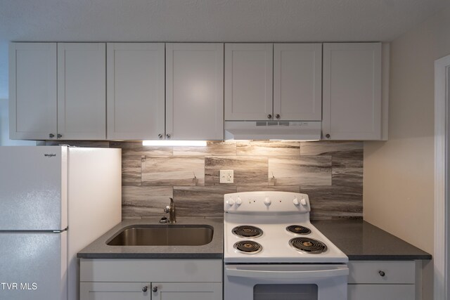 105 Lemay Dr, Kingsport, TN 37664 - kitchen featuring white appliances, under cabinet range hood, tasteful backsplash, and white cabinetry