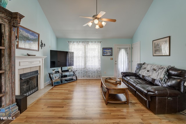 2146 Buttercup Ln, Limestone, TN 37681 - living room with a ceiling fan, a fireplace, light wood-style floors, and high vaulted ceiling