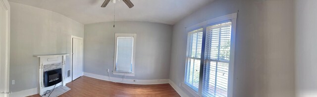 402 E Unaka Ave, Johnson City, TN 37601 - unfurnished living room with a fireplace, ceiling fan, and wood finished floors