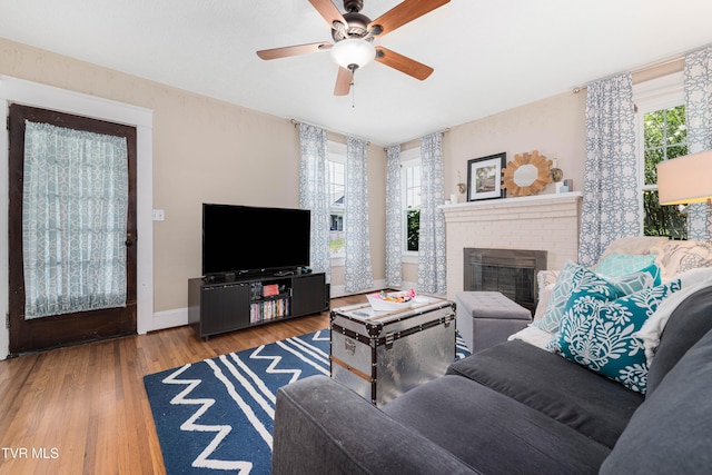 922 W Hillcrest Dr, Johnson City, TN 37604 - living area with healthy amount of natural light, wood finished floors, a ceiling fan, and a fireplace