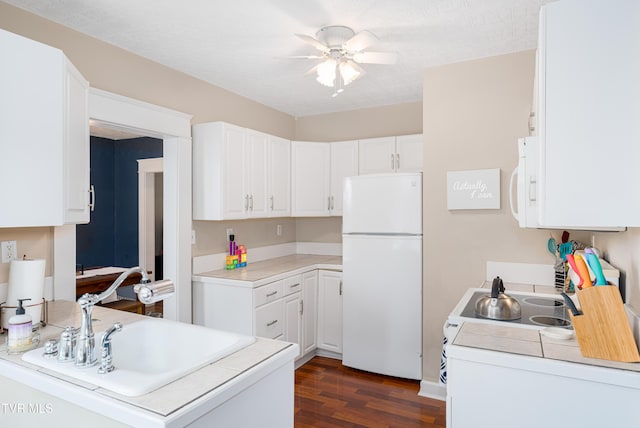 922 W Hillcrest Dr, Johnson City, TN 37604 - kitchen featuring freestanding refrigerator, dark wood finished floors, and white cabinetry