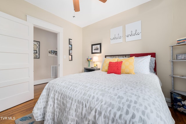 922 W Hillcrest Dr, Johnson City, TN 37604 - bedroom with wood finished floors, a baseboard heating unit, and a ceiling fan