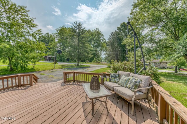 224 Meadow Dr, Bristol, TN 37620 - deck featuring outdoor lounge area, a lawn, and view of wooded area