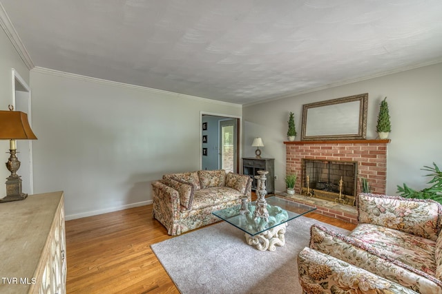 224 Meadow Dr, Bristol, TN 37620 - living room with a brick fireplace, light wood-style flooring, and crown molding
