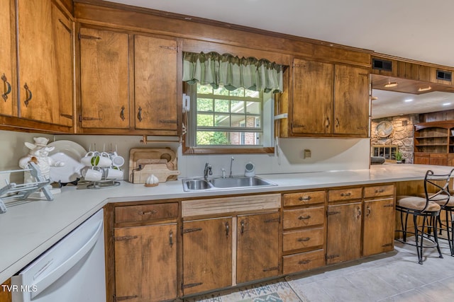 224 Meadow Dr, Bristol, TN 37620 - kitchen featuring white dishwasher, light countertops, and brown cabinets