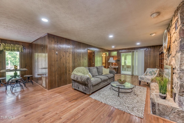 224 Meadow Dr, Bristol, TN 37620 - living room with a textured ceiling, wood walls, wood finished floors, and recessed lighting