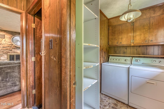 224 Meadow Dr, Bristol, TN 37620 - laundry room featuring independent washer and dryer, cabinet space, and a textured ceiling