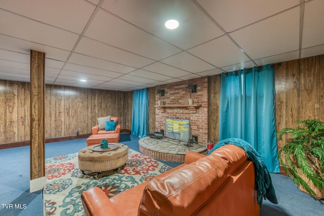 224 Meadow Dr, Bristol, TN 37620 - carpeted living room featuring a drop ceiling, wooden walls, and a fireplace