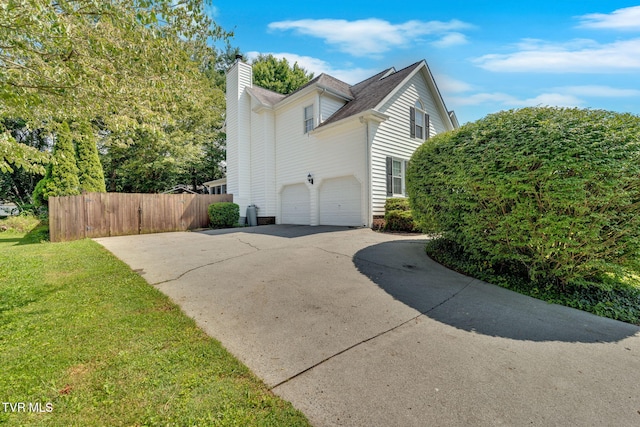 504 Amelia Ct, Blountville, TN 37617 - view of property exterior with driveway, a chimney, a shingled roof, and an attached garage