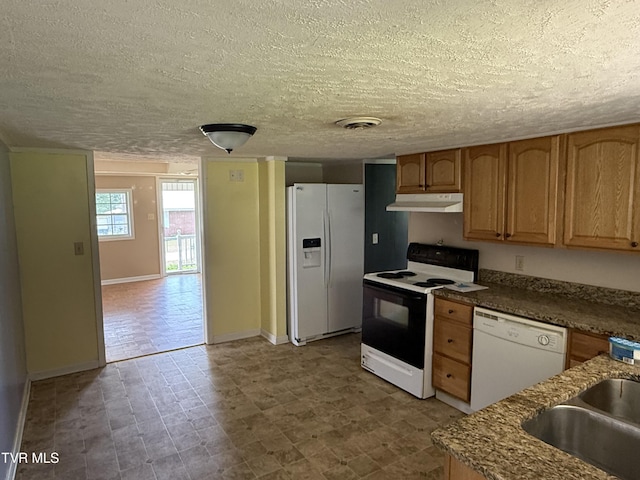 3126 Blackburn Ave, Kingsport, TN 37660 - kitchen with white appliances, under cabinet range hood, a textured ceiling, and dark stone countertops