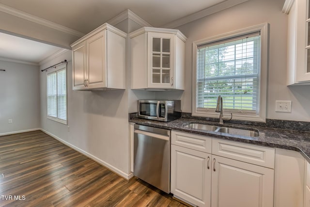 1367 Milligan Hwy, Johnson City, TN 37601 - kitchen with stainless steel appliances, dark wood-type flooring, white cabinetry, crown molding, and glass insert cabinets