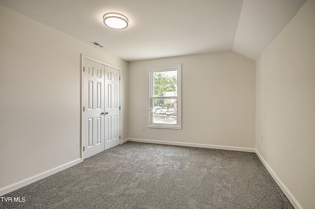 1010 Gibson Mill Rd, Kingsport, TN 37660 - unfurnished bedroom featuring carpet floors, lofted ceiling, and a closet
