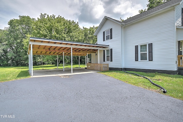 1010 Gibson Mill Rd, Kingsport, TN 37660 - view of front of home featuring a front lawn, a carport, and asphalt driveway