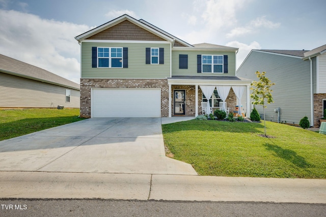 1233 Stamp Lodge Rd, Kingsport, TN 37660 - view of front of house featuring a front lawn, brick siding, a garage, and driveway