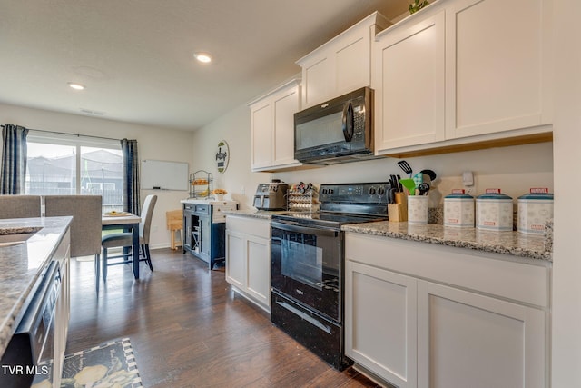 1233 Stamp Lodge Rd, Kingsport, TN 37660 - kitchen with black appliances, dark wood-type flooring, white cabinets, recessed lighting, and light stone counters