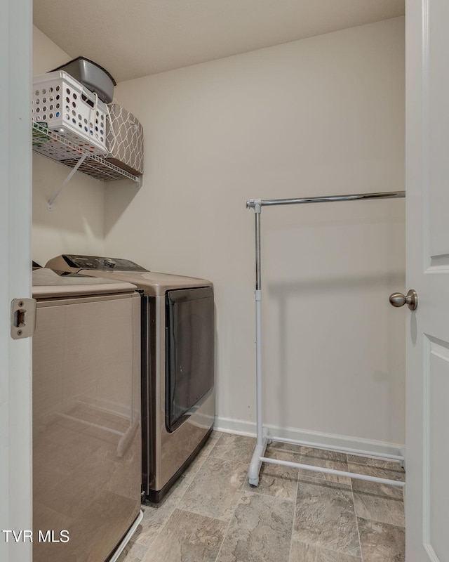 1233 Stamp Lodge Rd, Kingsport, TN 37660 - laundry room featuring washer and clothes dryer and baseboards