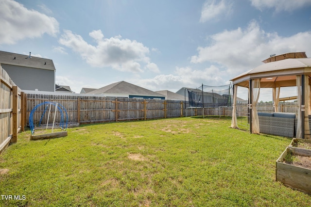 1233 Stamp Lodge Rd, Kingsport, TN 37660 - fenced backyard featuring a vegetable garden, a trampoline, and a gazebo