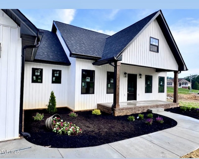 816 Hairetown Rd, Jonesborough, TN 37659 - modern inspired farmhouse with a porch and a shingled roof