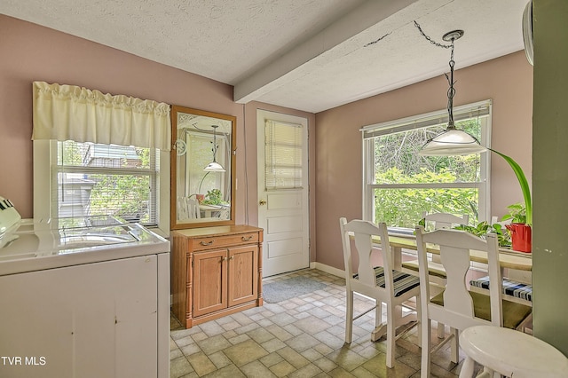 116 Esther St, Bristol, TN 37620 - dining room with a textured ceiling, light stone finish flooring, and washer and clothes dryer