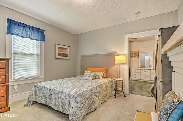 116 Esther St, Bristol, TN 37620 - bedroom featuring light carpet, a textured ceiling, and a fireplace