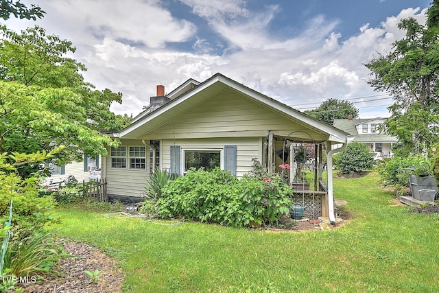 116 Esther St, Bristol, TN 37620 - back of property featuring a yard and a chimney