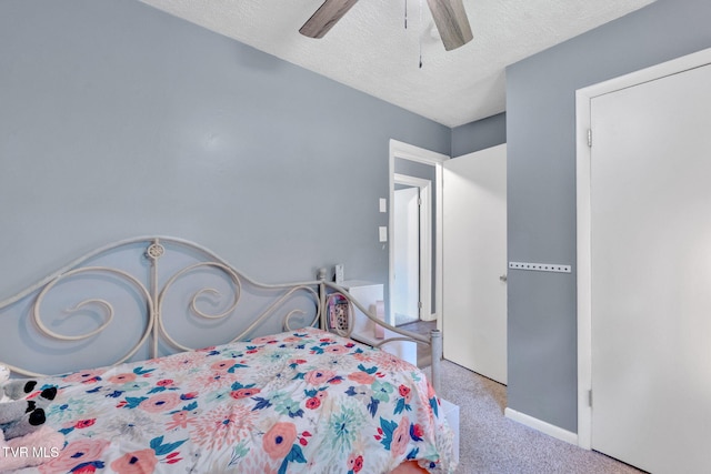 8202 Westland Dr, Knoxville, TN 37919 - carpeted bedroom featuring a textured ceiling and a ceiling fan