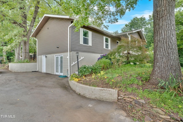 8202 Westland Dr, Knoxville, TN 37919 - view of home's exterior with brick siding and a patio