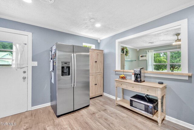 8202 Westland Dr, Knoxville, TN 37919 - kitchen featuring appliances with stainless steel finishes, a textured ceiling, crown molding, light wood-style floors, and recessed lighting