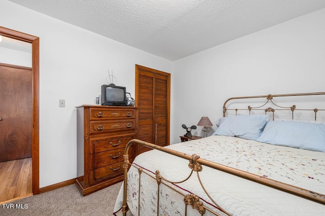 780 Hamilton Rd Unit E6, Blountville, TN 37617 - bedroom with a closet, light carpet, and a textured ceiling