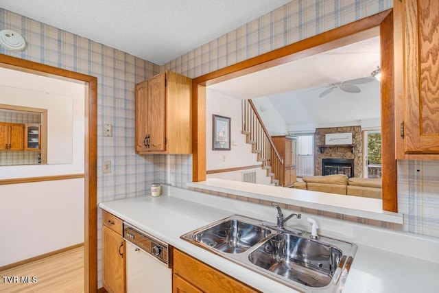 780 Hamilton Rd Unit E6, Blountville, TN 37617 - kitchen featuring white dishwasher, wallpapered walls, a fireplace, light countertops, and ceiling fan